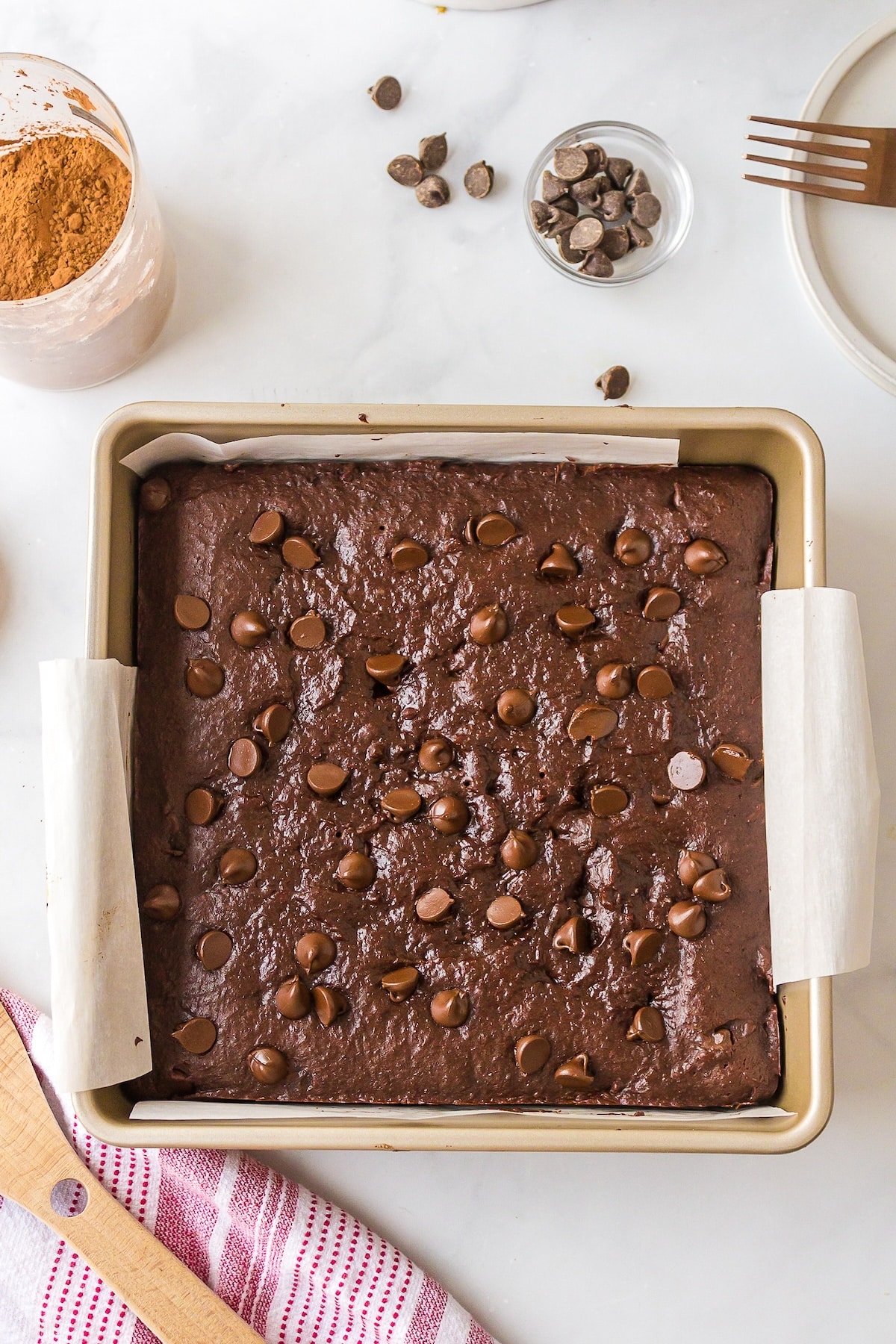 baking dish with baked dairy free brownies on tabletop.