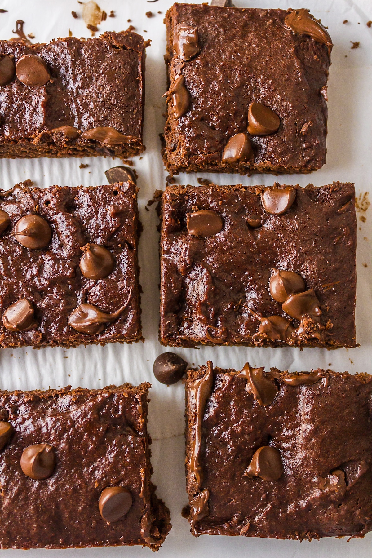 baked dairy-free brownies on parchment paper.