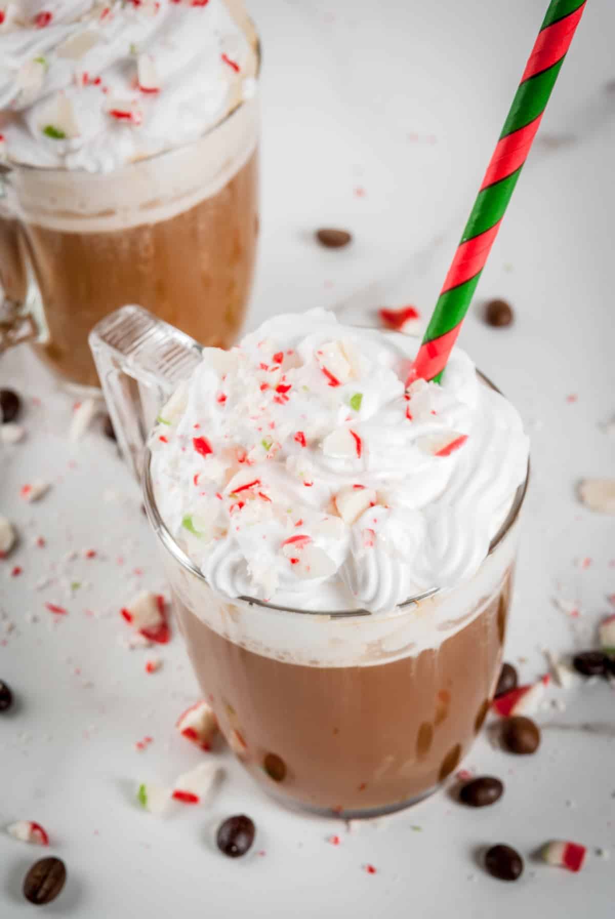 two cups of peppermint coffee with straws.