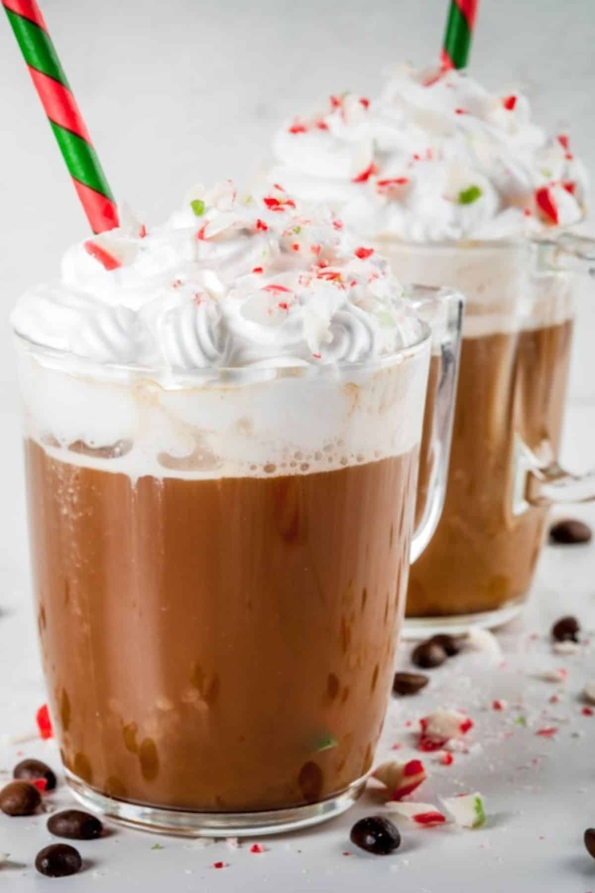 a glass of peppermint coffee topped with whipped cream.