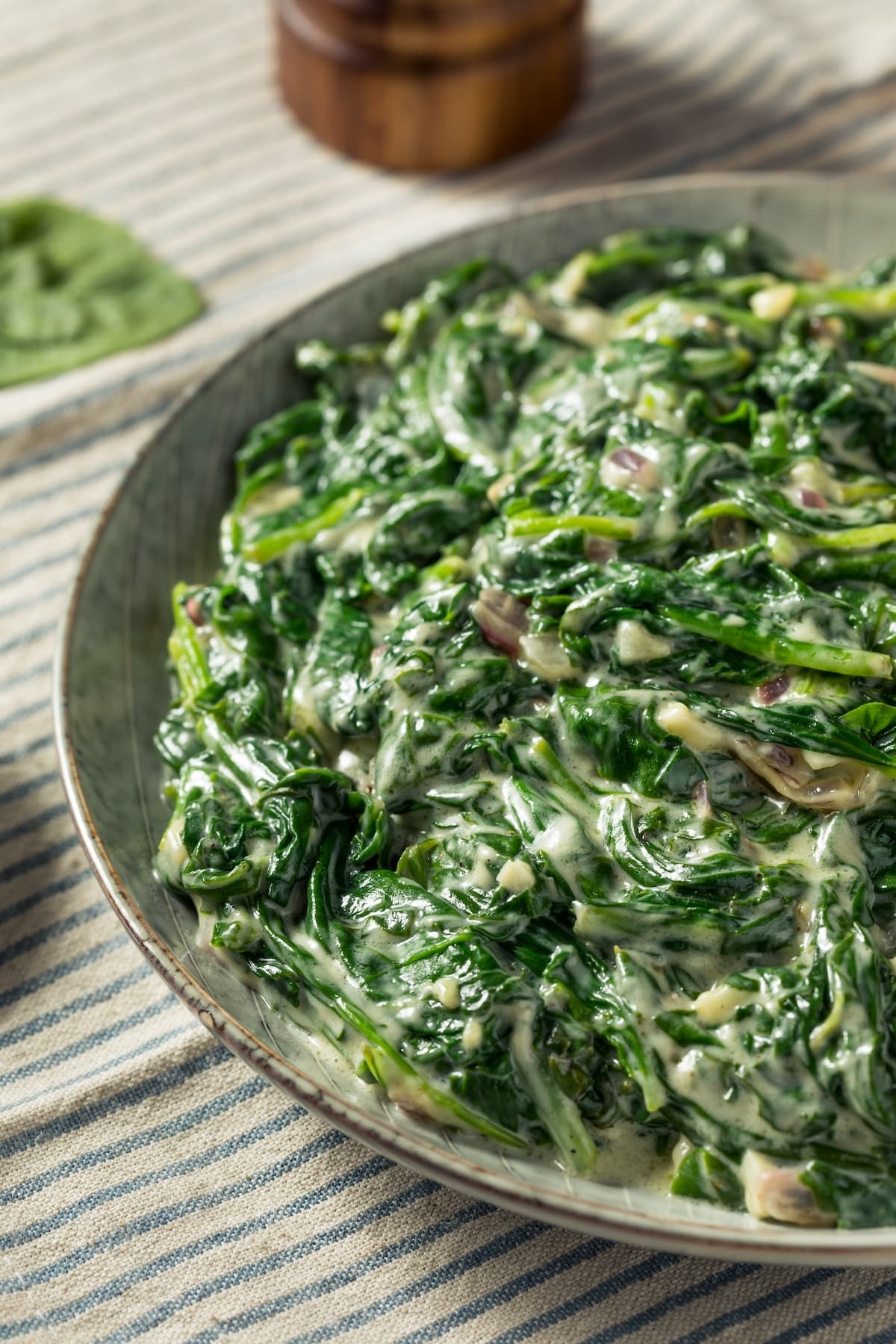 bowl of vegan creamed kale made with coconut milk.