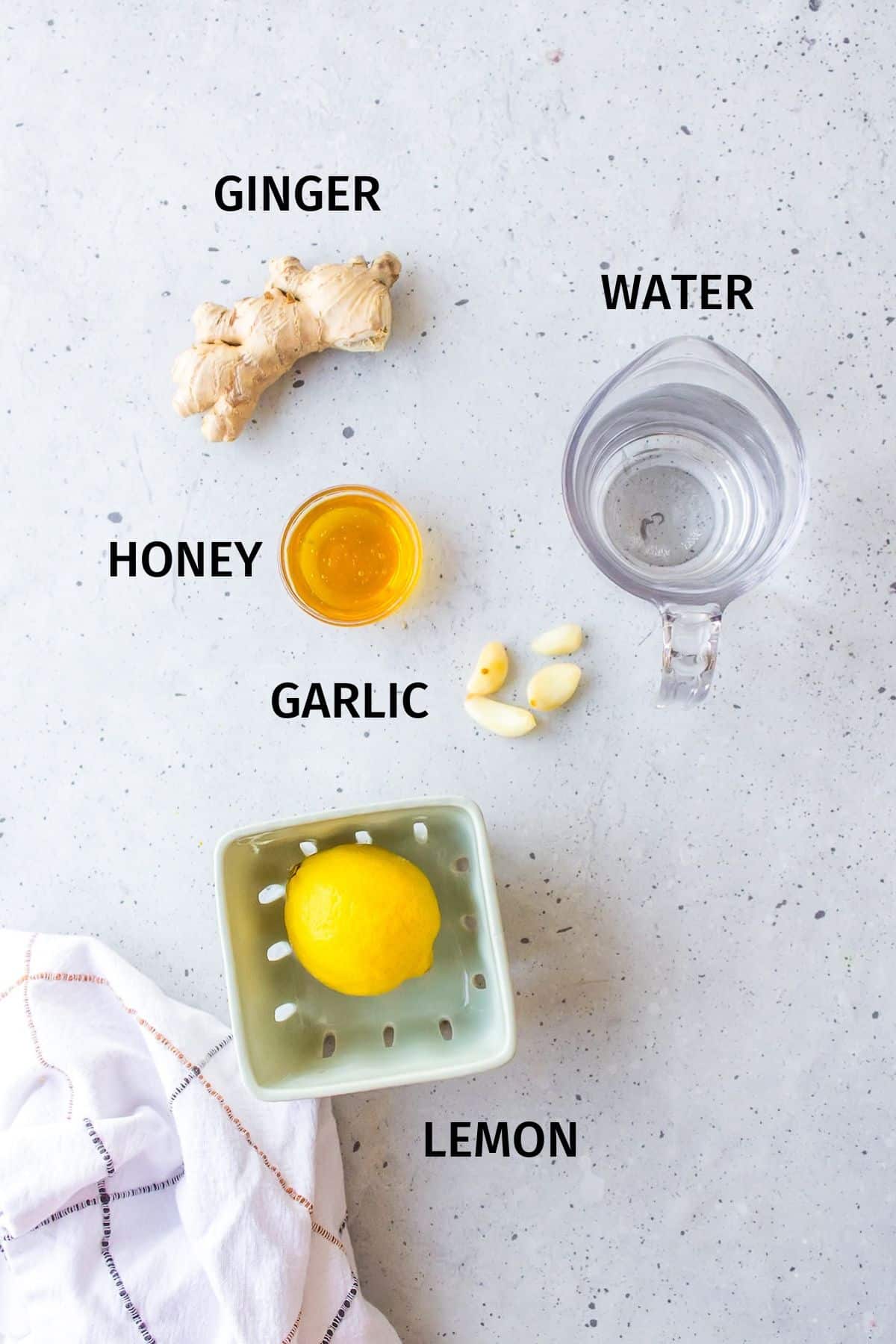 ingredients for ginger tea on a counter.