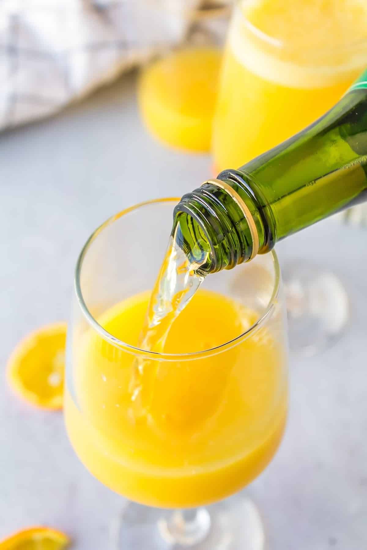 sparkling juice being poured into glass.