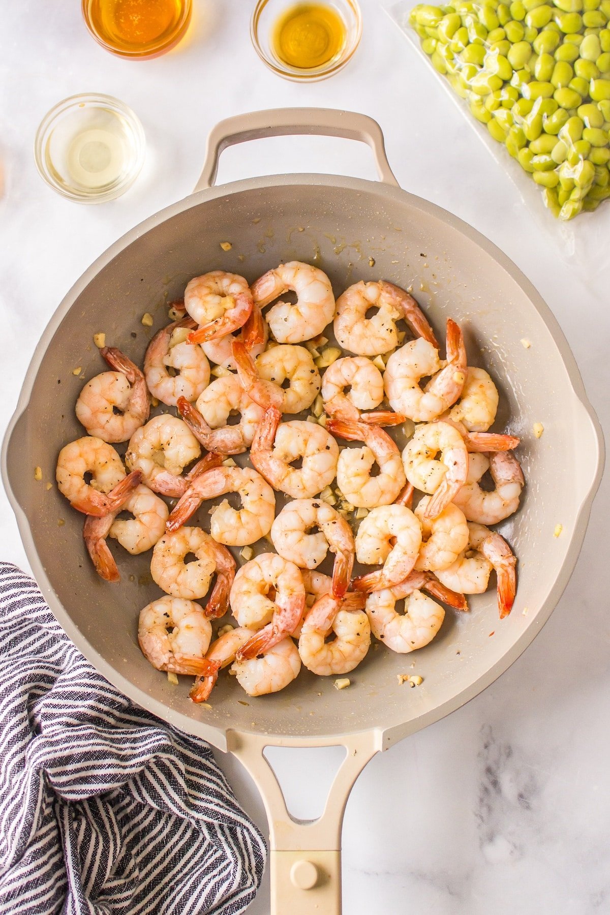 shrimp cooking in a skillet.