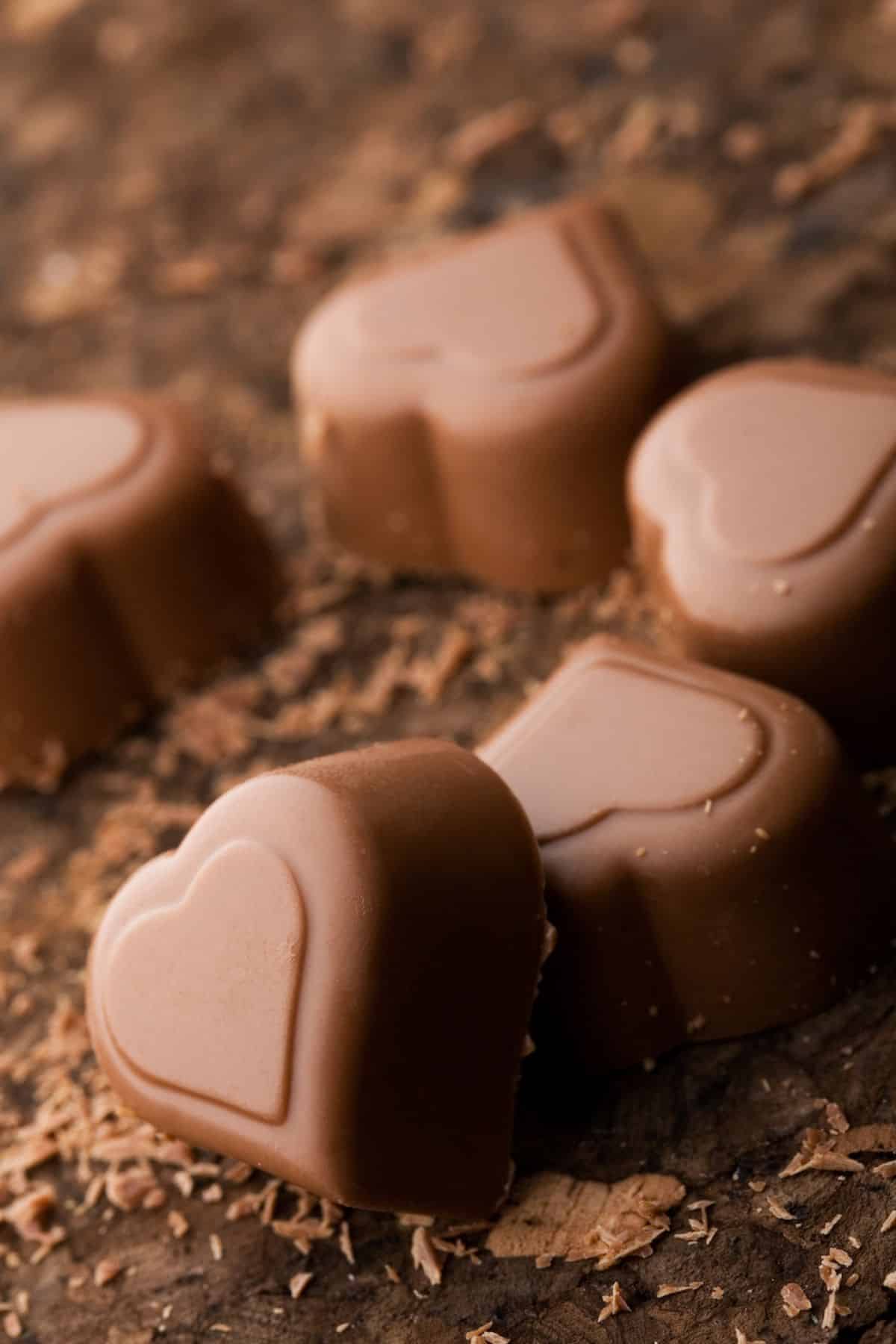 homemade dark chocolate hearts on table.