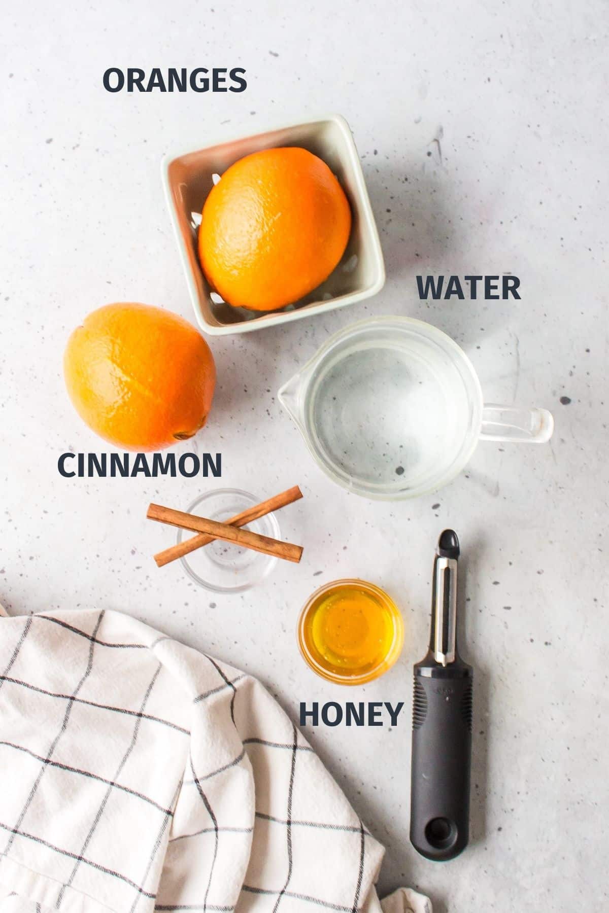 ingredients for orange peel tea on a countertop.