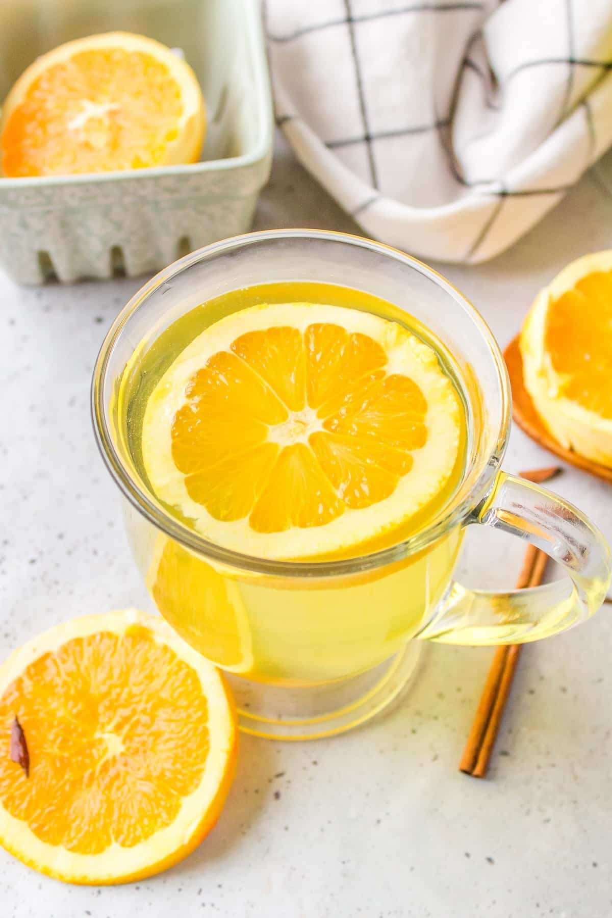 a glass mug of orange peel tea.