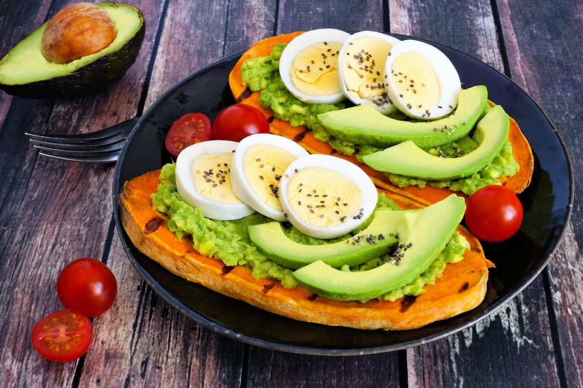 sweet potato toasts topped with avocado and eggs.