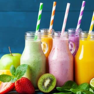 colorful gut health smoothies on table with straws.