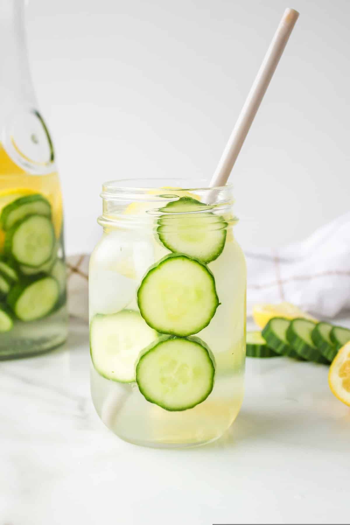 cucumber spa water with paper straw.