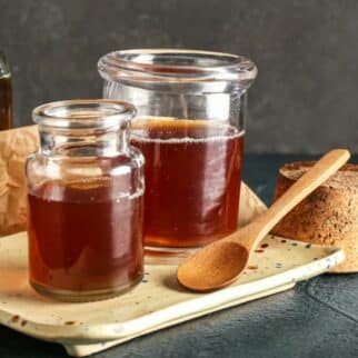 coconut nectar syrup in jars on table with spoon.