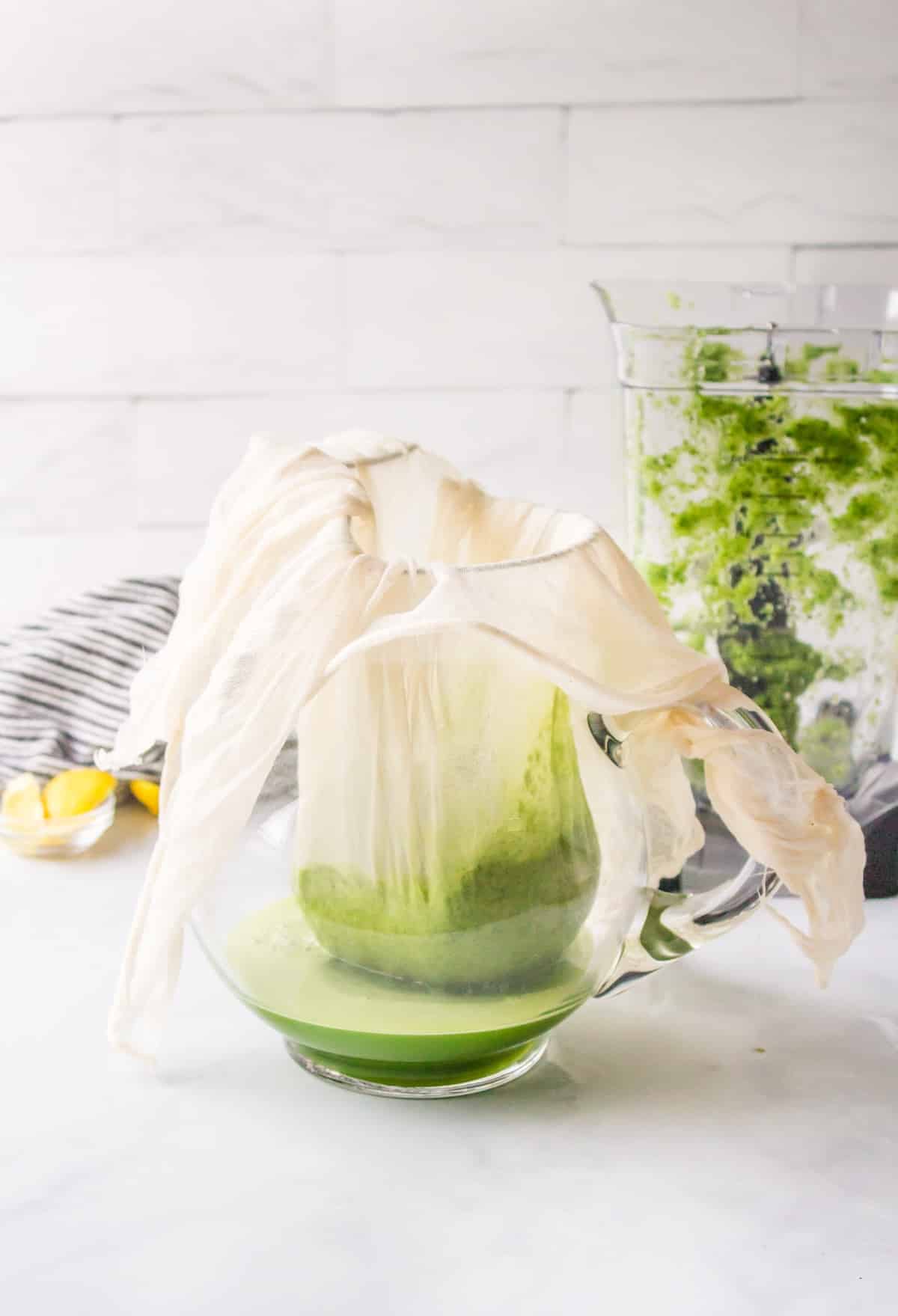 how to strain green juice into a pitcher.