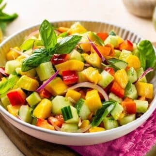 bell pepper cucumber salad in white bowl.