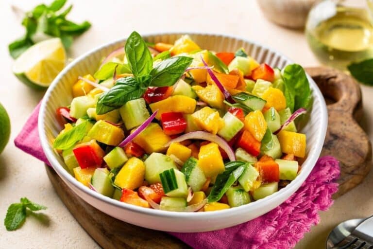 bell pepper cucumber salad in white bowl.
