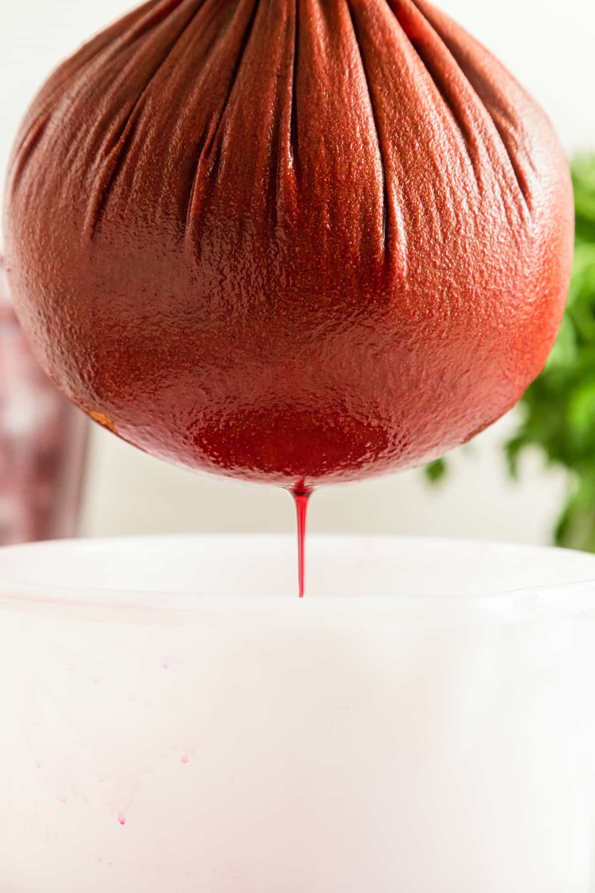 straining beet juice.