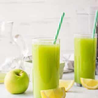 apple ginger lemon juice served in two glasses.